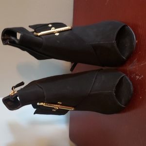 Black sandal peep toe shoe with gold buckle